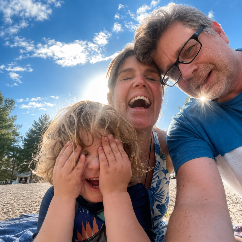 Selfie of Hannah with her husband Nick and son Max in an outdoor setting.