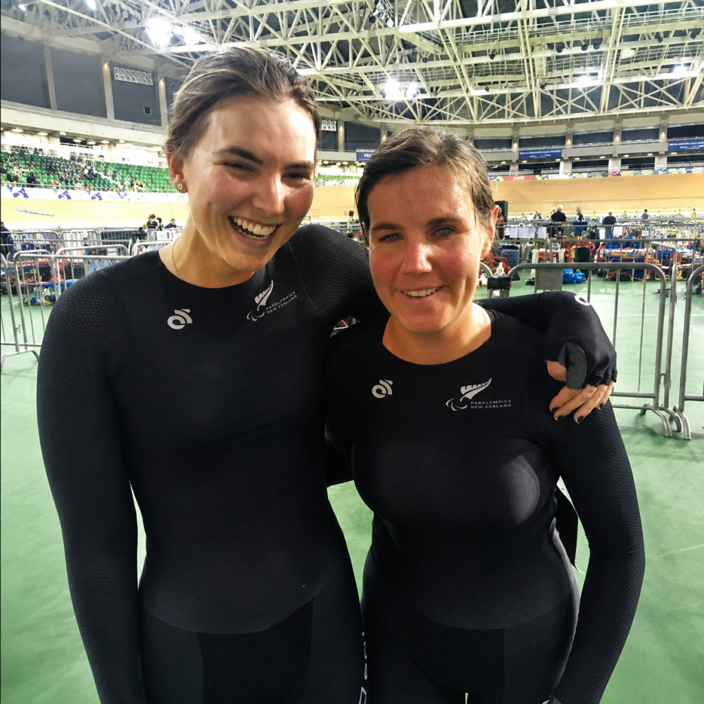 Hannah and her 2018 pilot Nina at the 2018 UCI Para-cycling Track World Championships, wearing their New Zealand cycling kit.