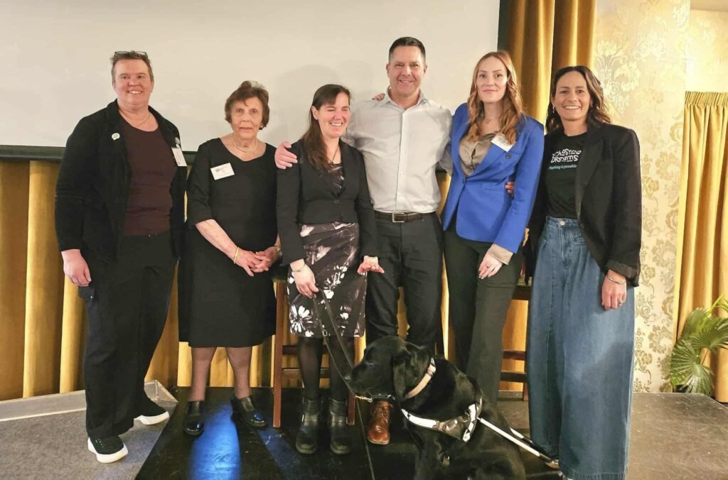 Hannah, Andrew Moreton, her cousin Kara, and other guests at the National Women’s Breakfast.